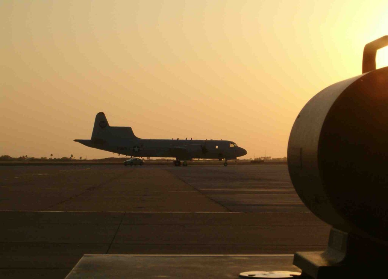 Navy P-3 sillouhetted against the sunset