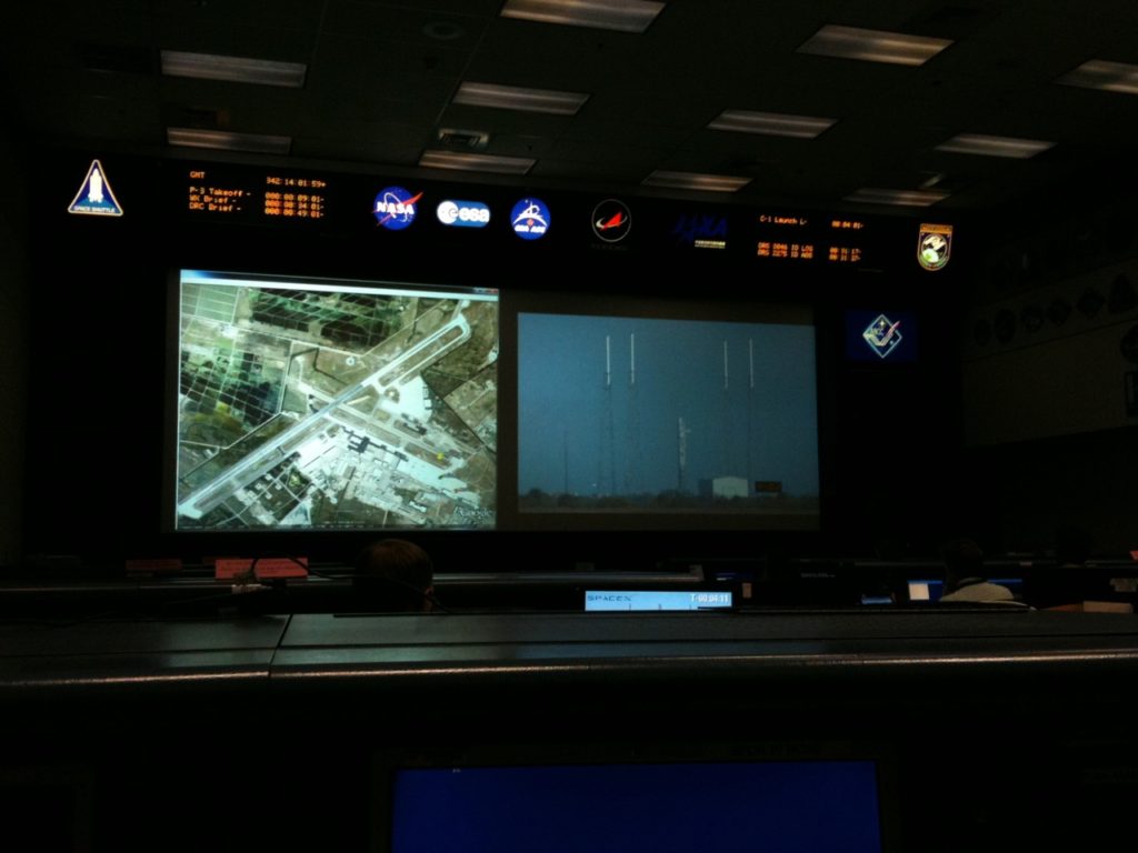The main display of mission control during the mission