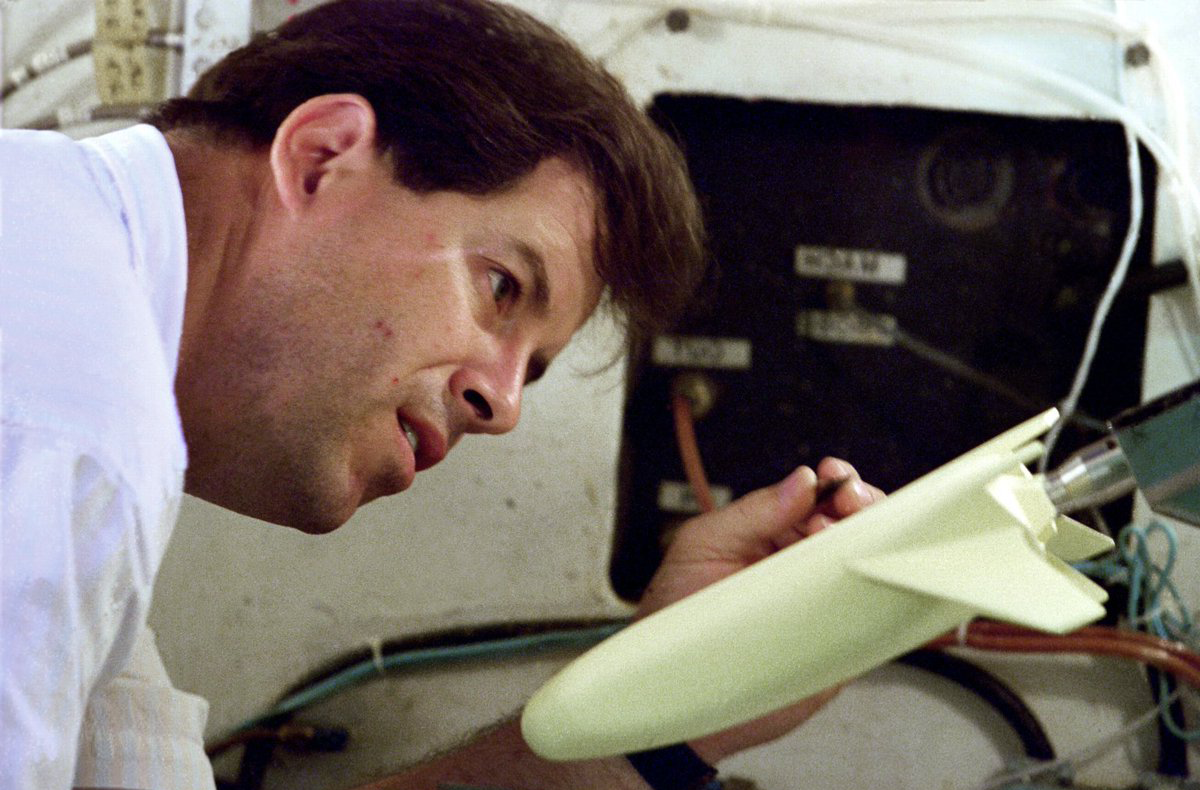 Thomas Horvath, Principal Investigator, examining X-33 wind-tunnel model