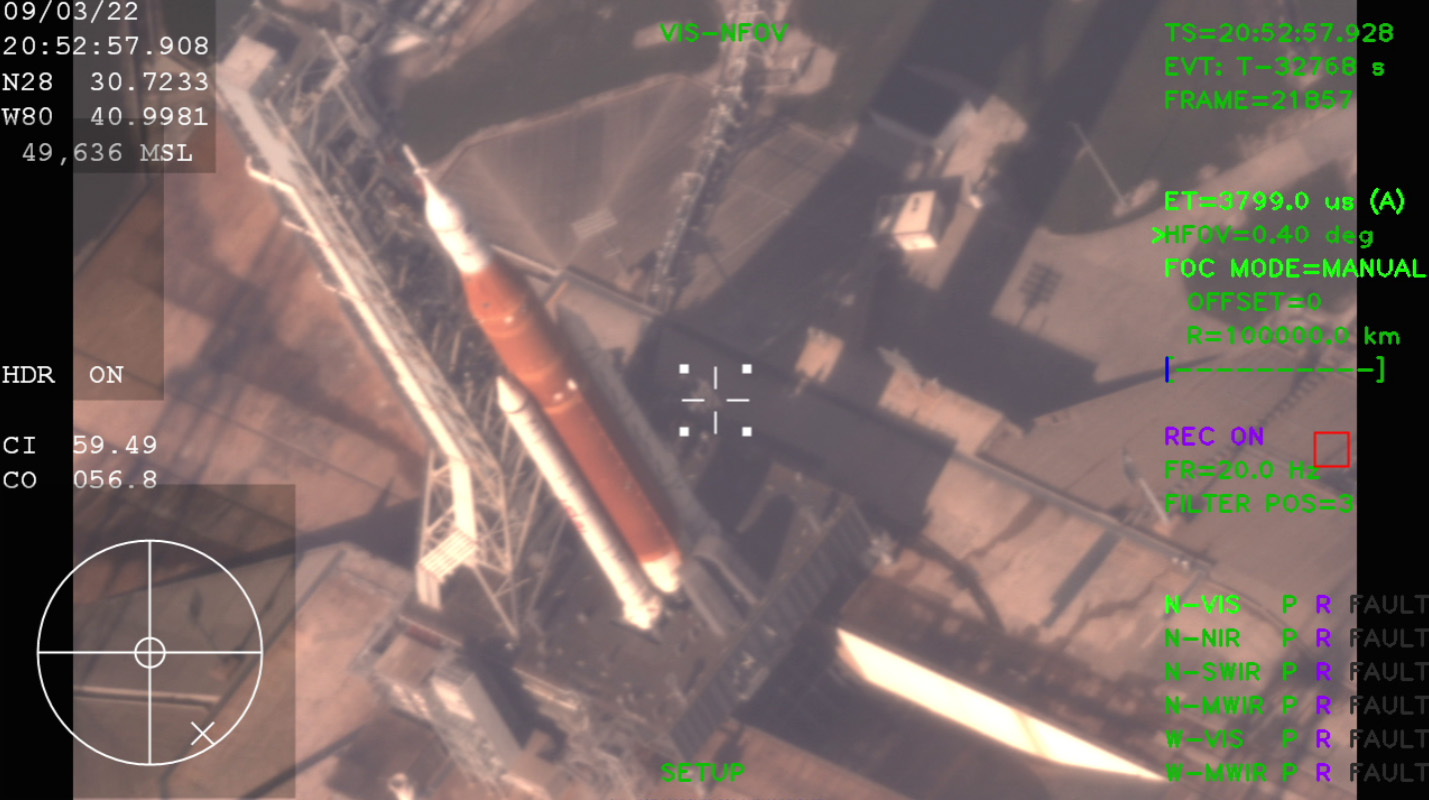 Artemis I on the launchpad, image taken from above. Includes technical information like imaging wavelength, time, and date.