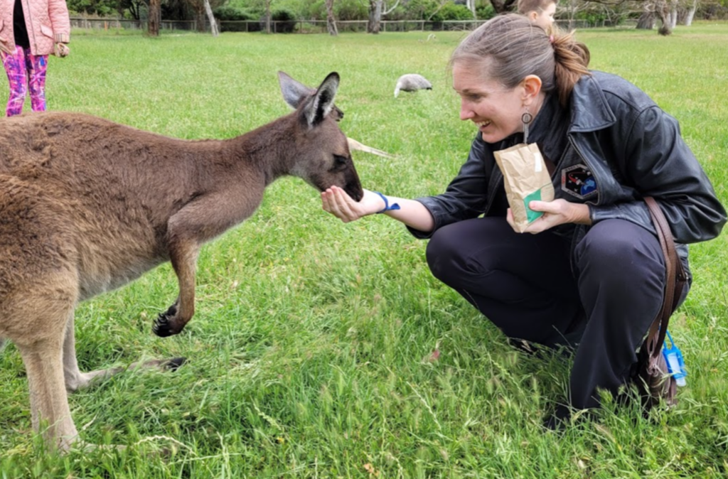 Project Manager, Dr. Jennifer Inman, feeding a kangaroo