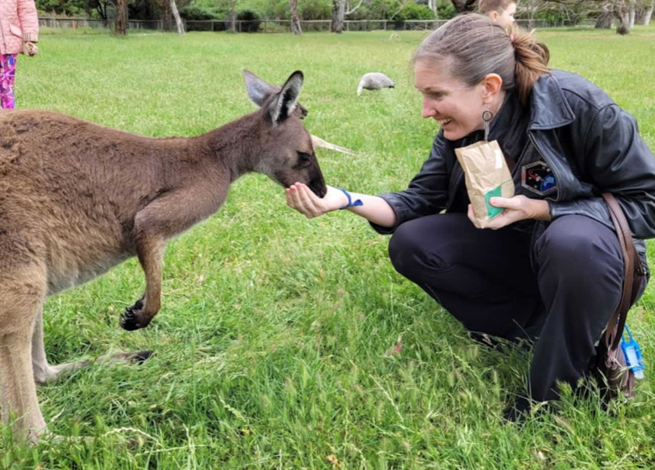 Project Manager, Dr. Jennifer Inman, feeding a kangaroo