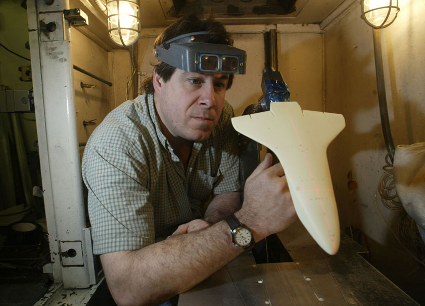 Principle investigator Tom Horvath examines a space shuttle wind-tunnel model