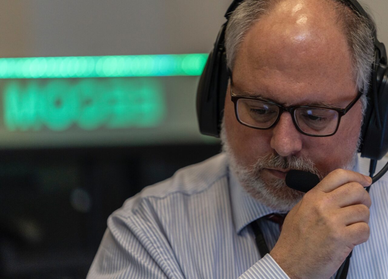 Rich Schwartz in mission control with a headset.